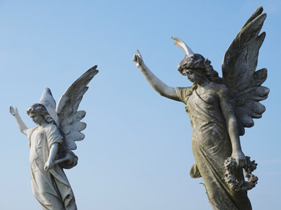 Sculptures of Angels pointing upward