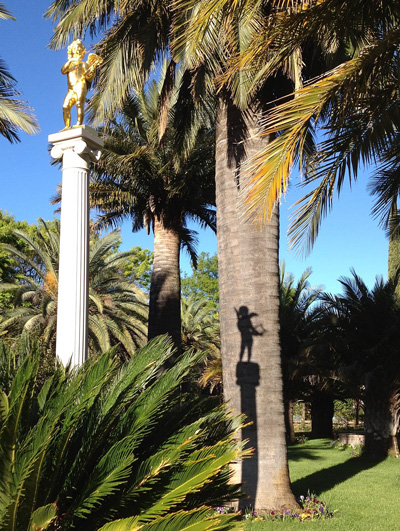 view of gold angel and palm tree