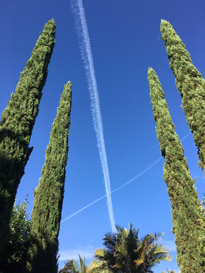 cross of con trails in the sky