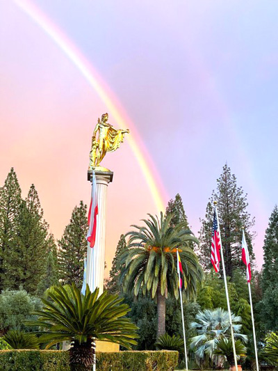 Rainbow over statue