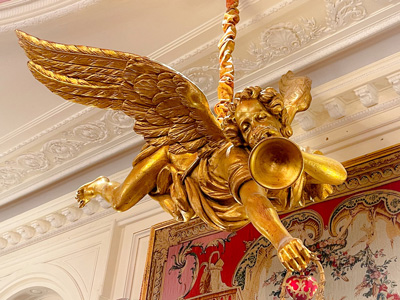 Angel with trumpet suspended from ceiling