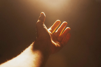 hand reaching to light